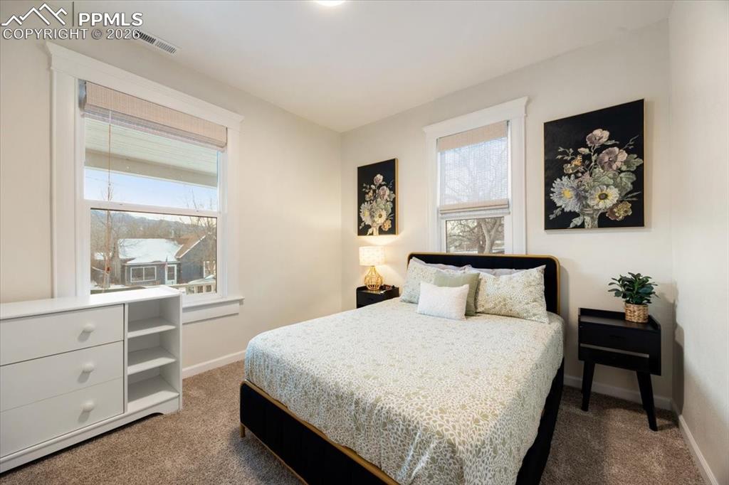 421 South Prospect Street Colorado Springs, CO 80903 - Photo 16 of 48 a bedroom with a bed and a window