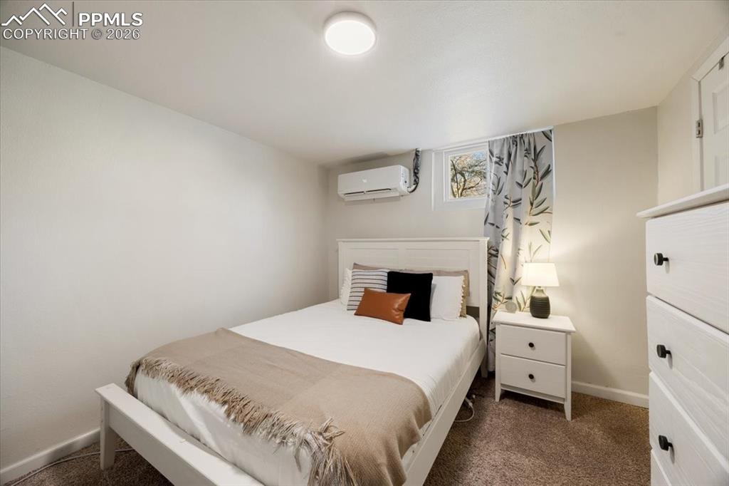 421 South Prospect Street Colorado Springs, CO 80903 - Photo 24 of 48 a bed room with a bed and a white wall