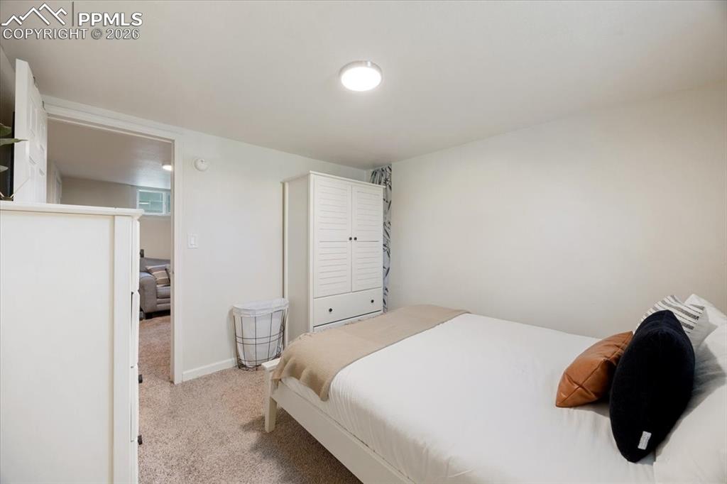 421 South Prospect Street Colorado Springs, CO 80903 - Photo 25 of 48 a bedroom with a bed and a lamp