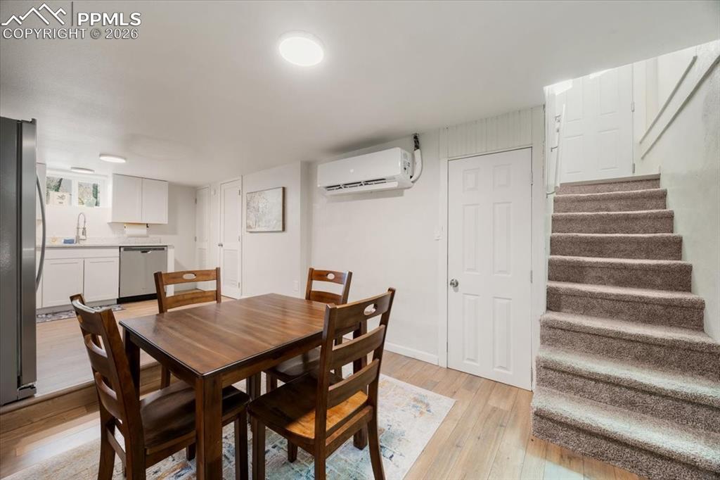 421 South Prospect Street Colorado Springs, CO 80903 - Photo 30 of 48 a view of a dining room with furniture and wooden floor