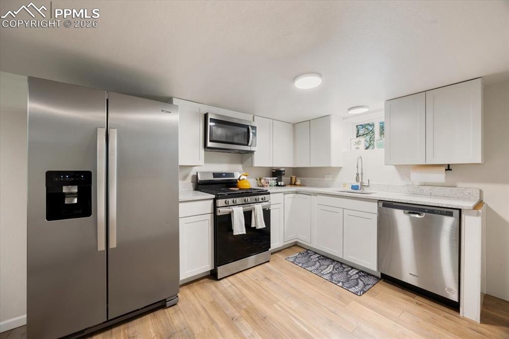 421 South Prospect Street Colorado Springs, CO 80903 - Photo 32 of 48 a kitchen with a refrigerator stove and sink