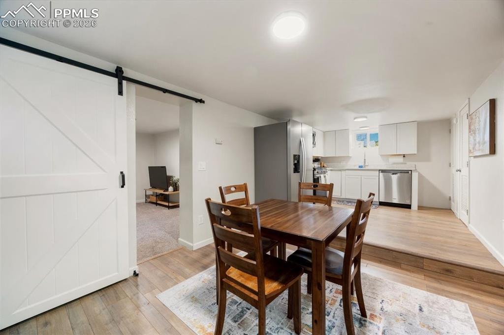 421 South Prospect Street Colorado Springs, CO 80903 - Photo 33 of 48 a view of a dining room with furniture and wooden floor