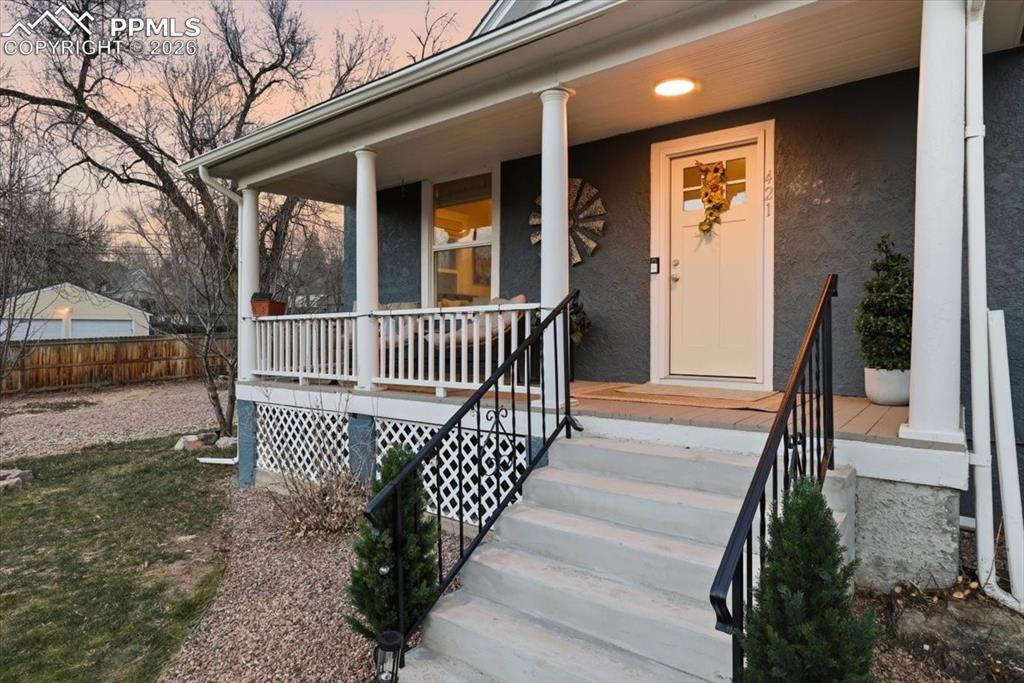 421 South Prospect Street Colorado Springs, CO 80903 - Photo 45 of 48 a view of a porch with wooden floor and fence