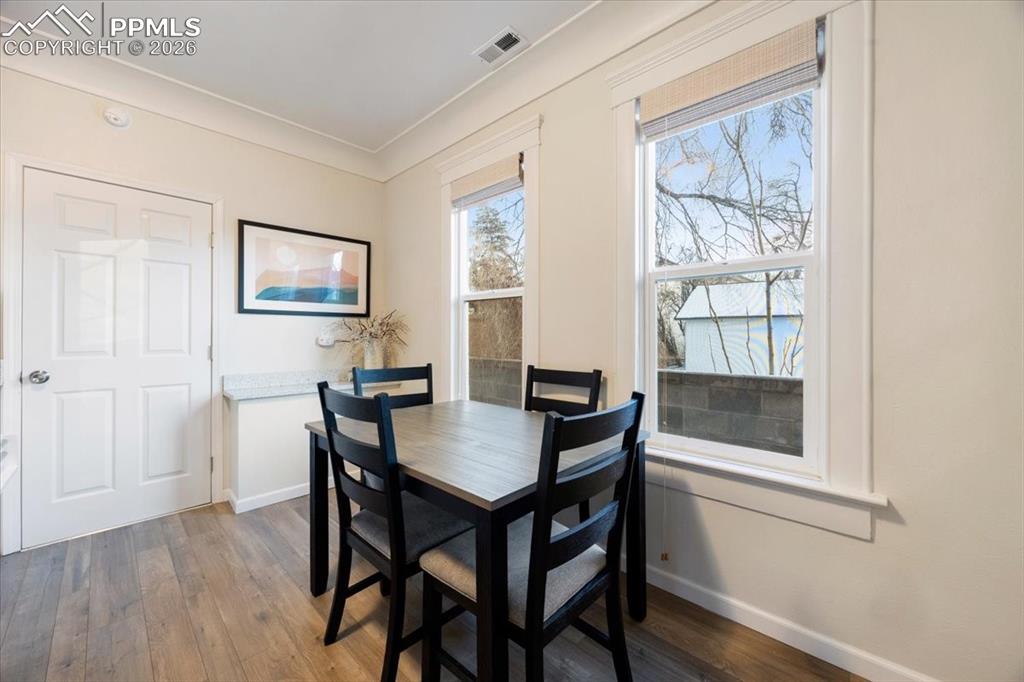 421 South Prospect Street Colorado Springs, CO 80903 - Photo 7 of 48 a view of a dining room with furniture and wooden floor