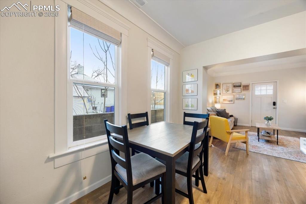 421 South Prospect Street Colorado Springs, CO 80903 - Photo 10 of 48 a view of a dining room with furniture and wooden floor