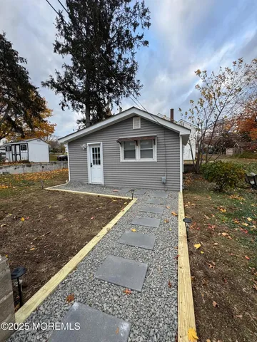 a backyard of a house with lots of green space