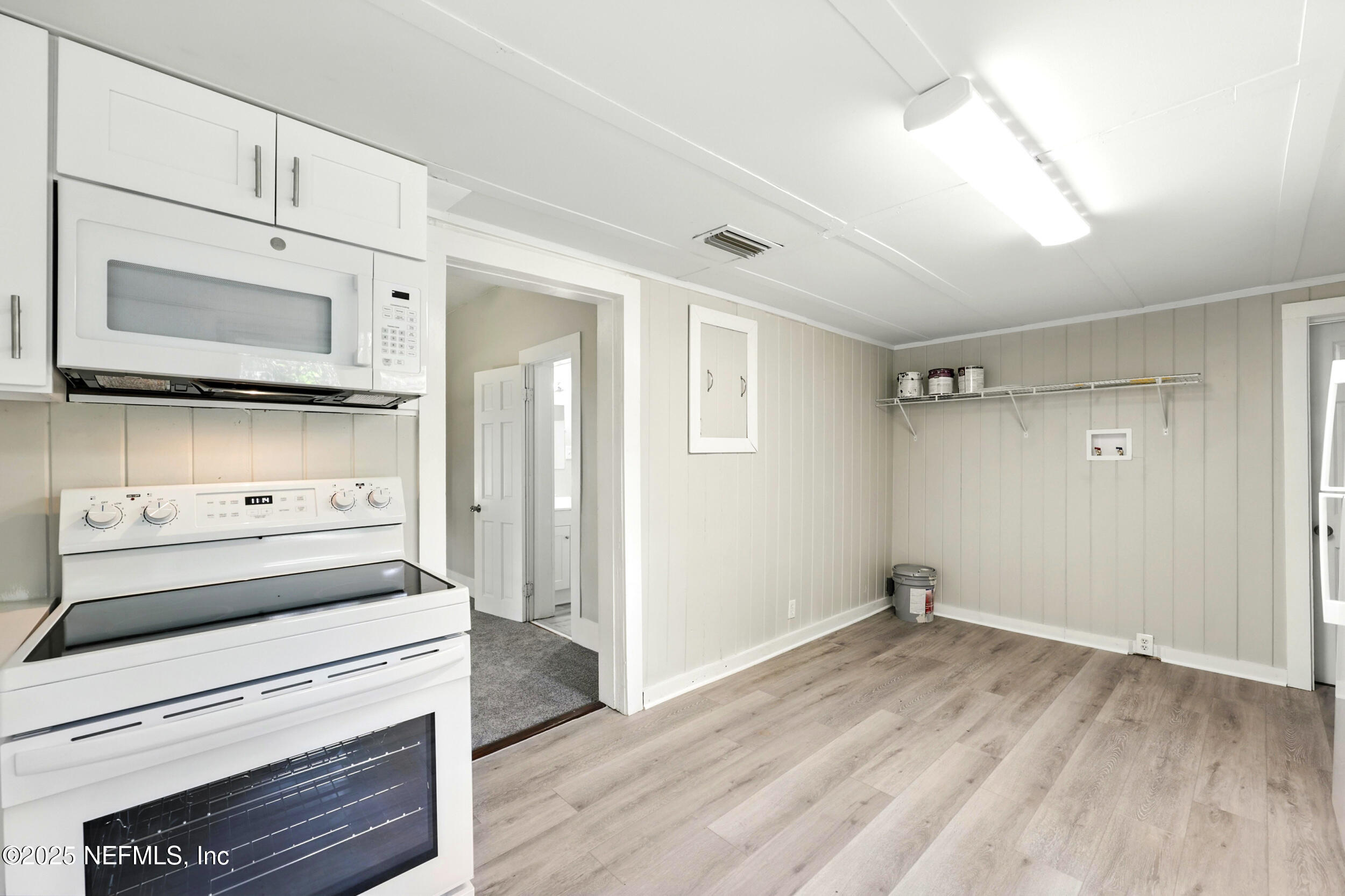 2858 Downing Street Jacksonville, FL 32205 - Photo 11 of 29 a kitchen with a stove and a microwave