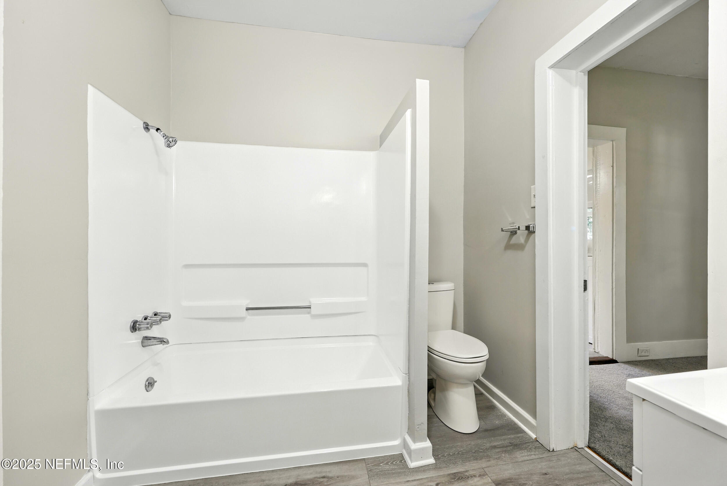 2858 Downing Street Jacksonville, FL 32205 - Photo 15 of 29 a bathroom with a sink a toilet and shower
