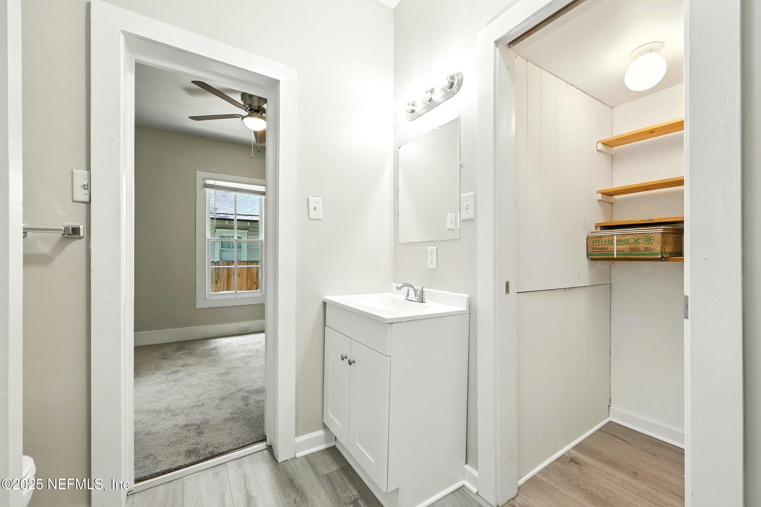 2858 Downing Street Jacksonville, FL 32205 - Photo 16 of 29 a view of bathroom with a sink mirror and shower