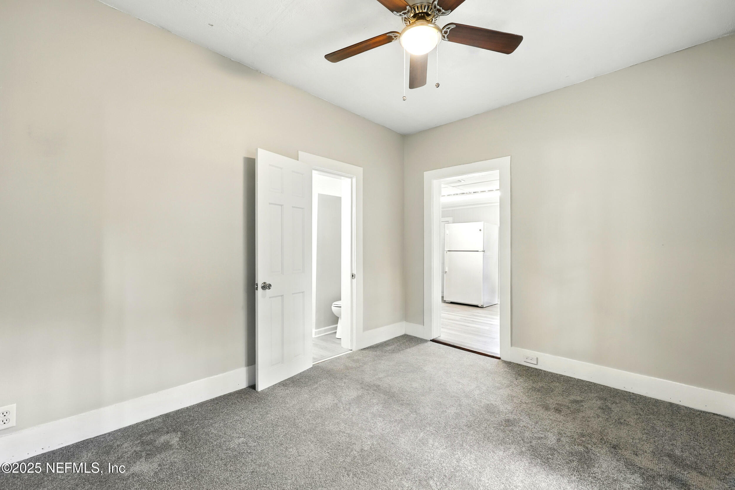 2858 Downing Street Jacksonville, FL 32205 - Photo 18 of 29 an empty room with a empty space and a ceiling fan