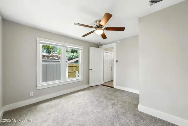 a view of empty room with windows