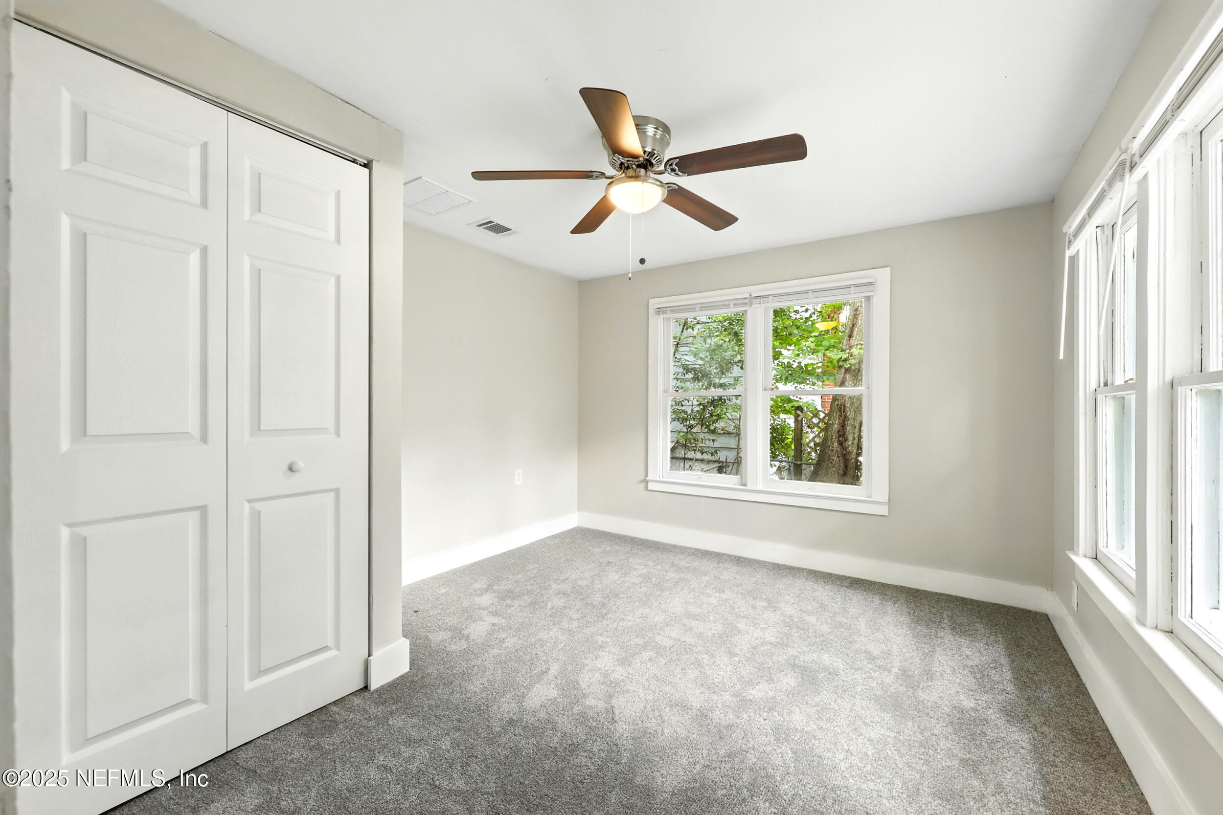 2858 Downing Street Jacksonville, FL 32205 - Photo 23 of 29 a view of empty room with window and ceiling fan