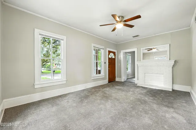 a view of an empty room with a window