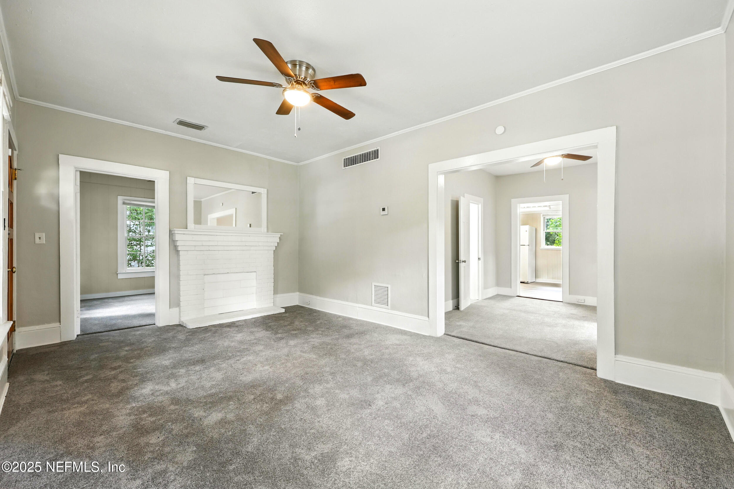 2858 Downing Street Jacksonville, FL 32205 - Photo 6 of 29 an empty room with closet and windows