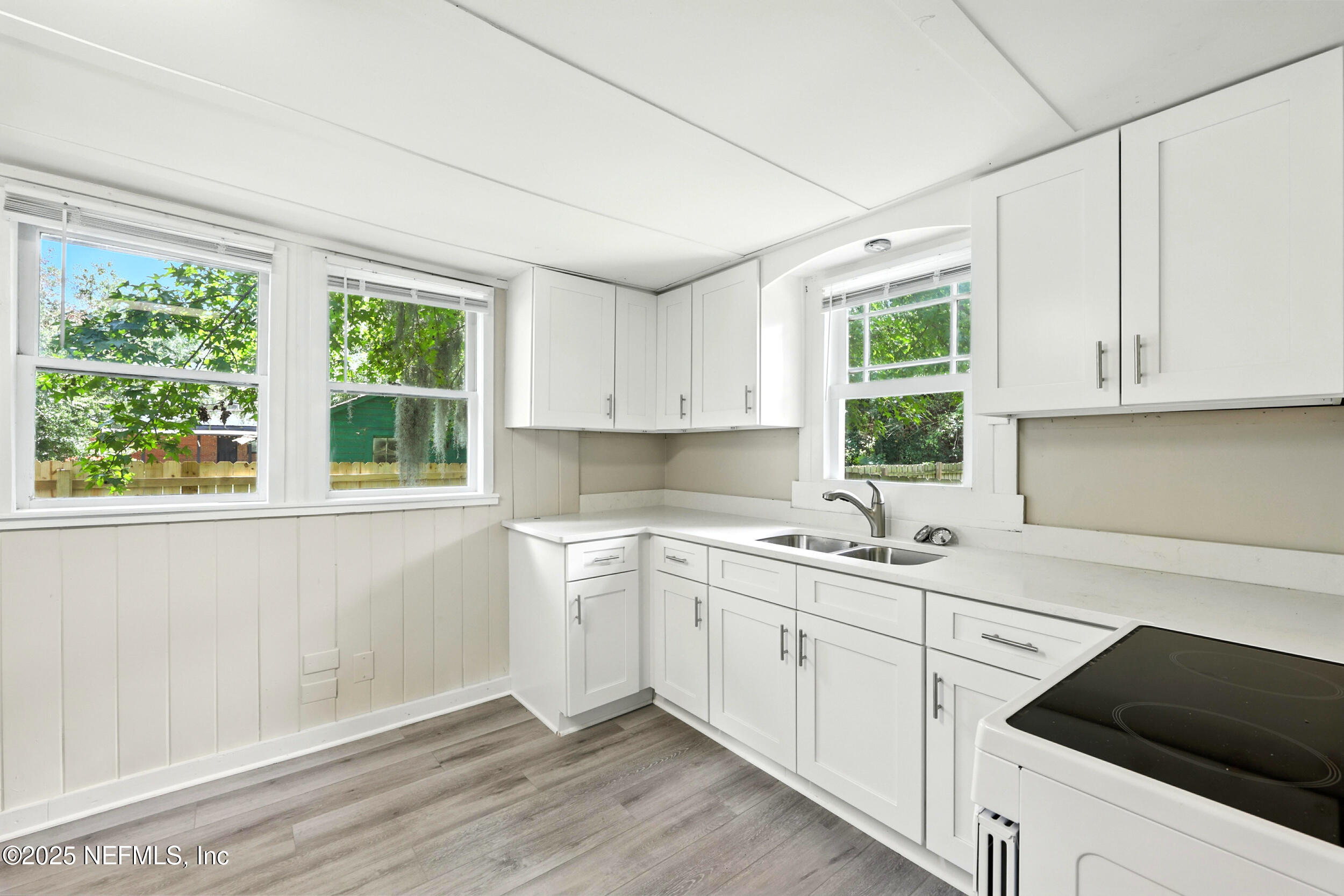 2858 Downing Street Jacksonville, FL 32205 - Photo 10 of 29 a kitchen with a sink stove and cabinets