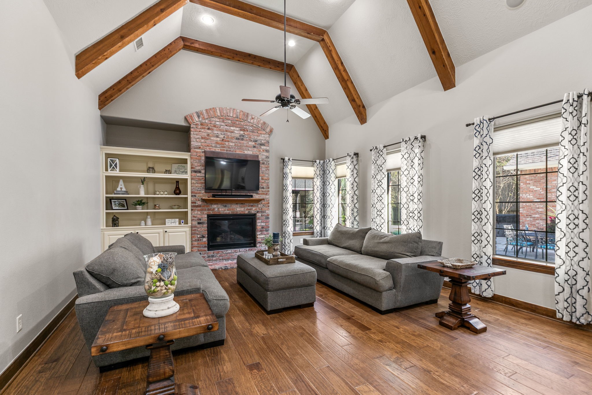 3811 Rayford Road Spring, TX 77386 - Photo 11 of 50 a living room with fireplace furniture and a large window