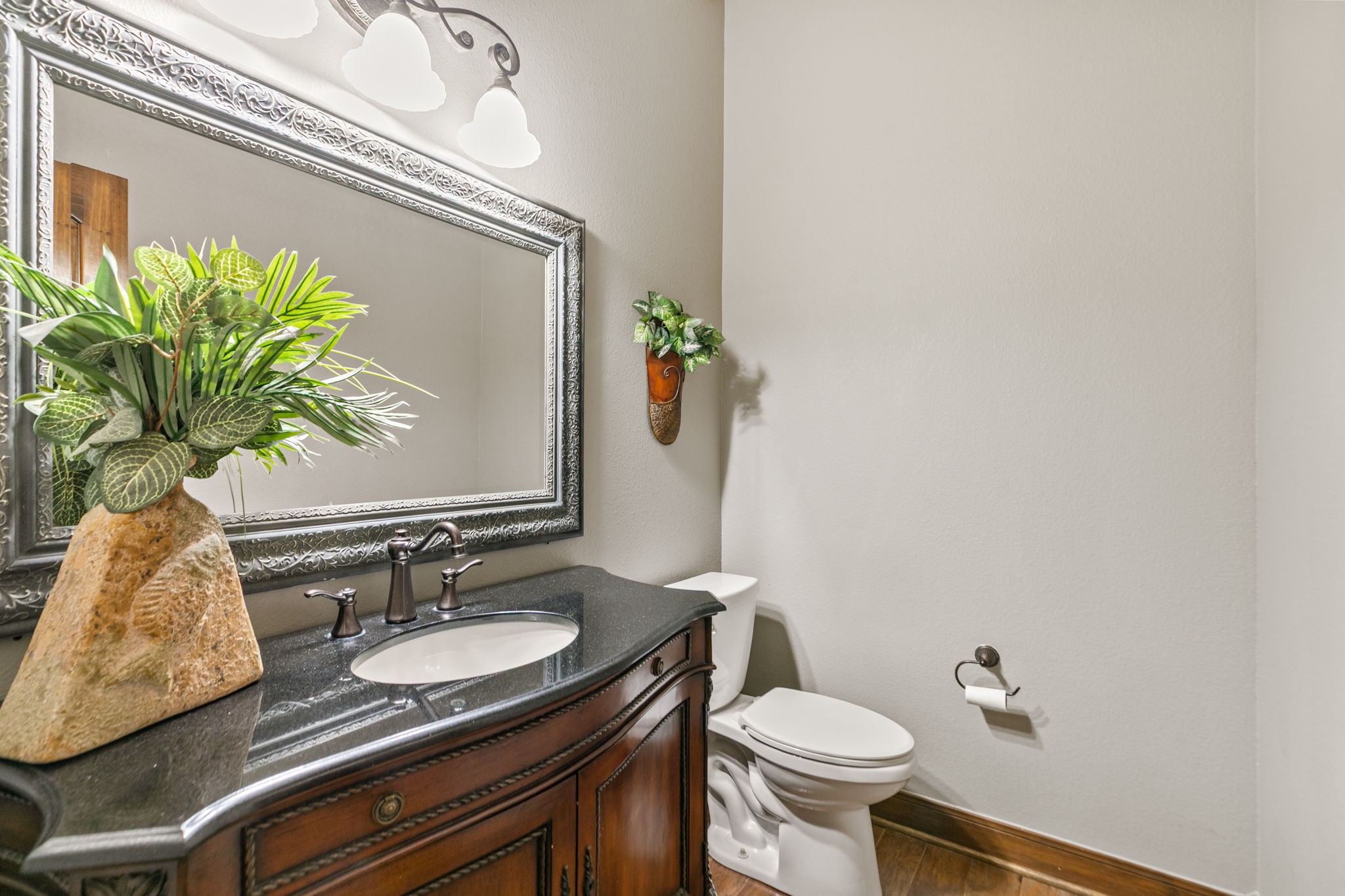 3811 Rayford Road Spring, TX 77386 - Photo 17 of 50 a bathroom with a granite countertop sink and a mirror