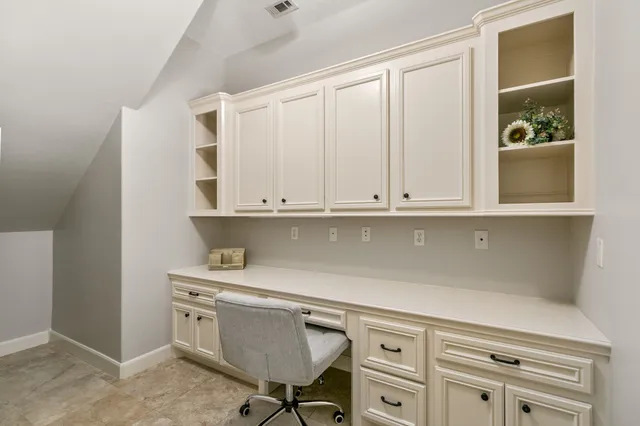 a kitchen with cabinets appliances and a counter top space