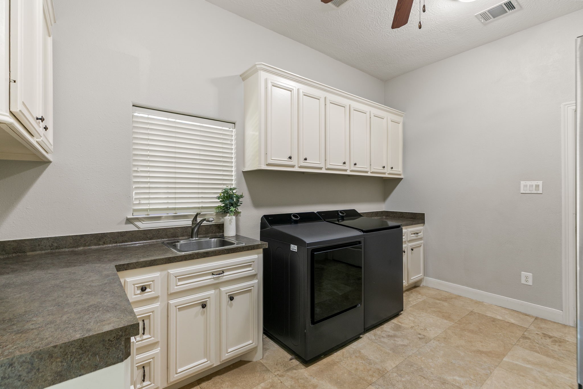 3811 Rayford Road Spring, TX 77386 - Photo 20 of 50 a kitchen with granite countertop white cabinets and a stove