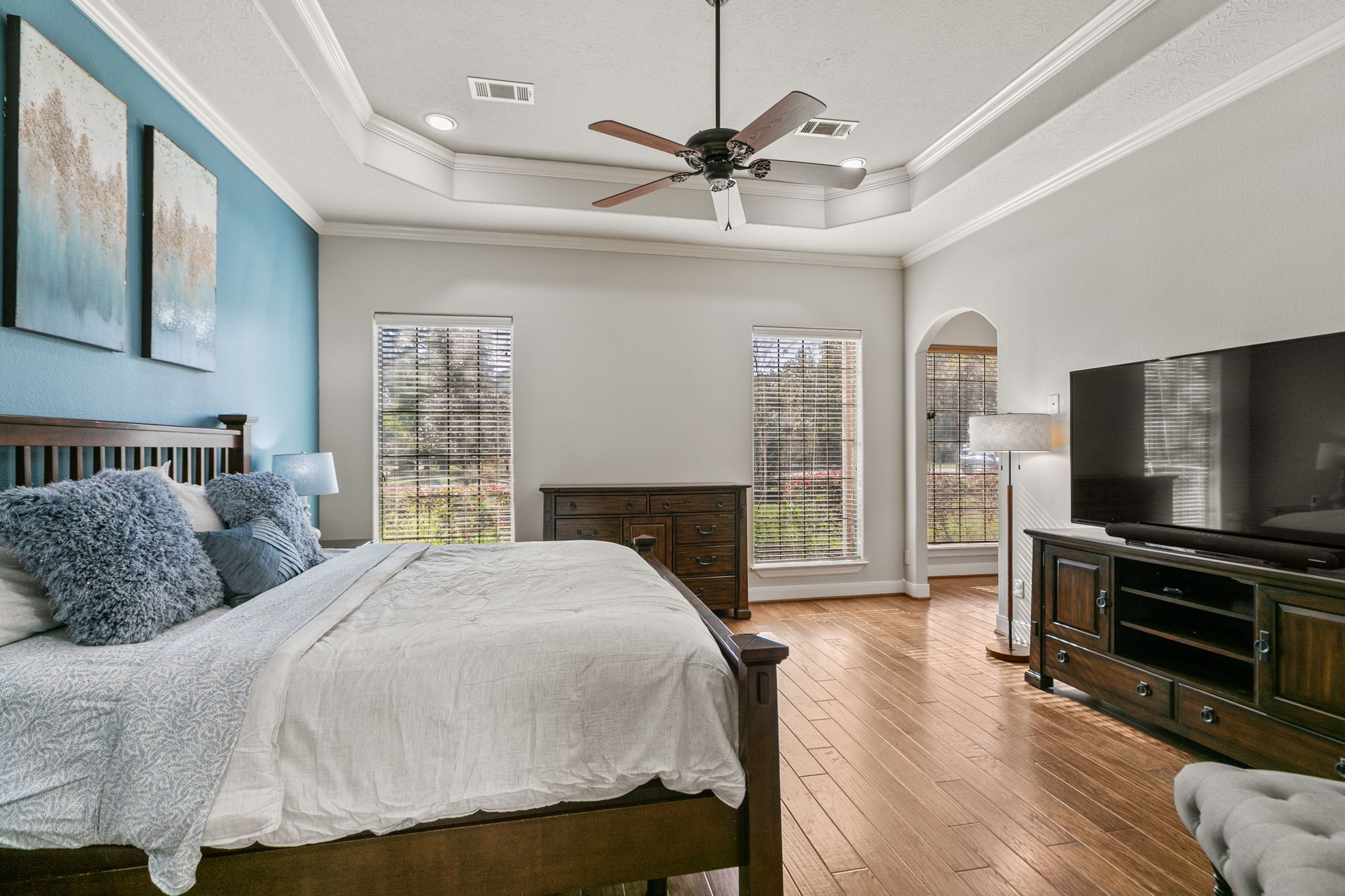 3811 Rayford Road Spring, TX 77386 - Photo 21 of 50 a bedroom with a bed and a flat screen tv