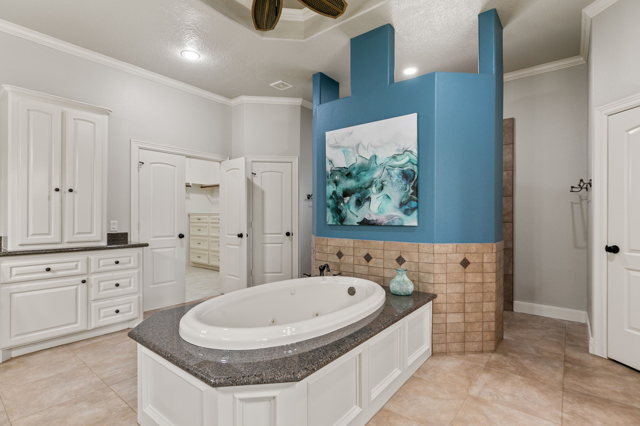 3811 Rayford Road Spring, TX 77386 - Photo 23 of 50 a spacious bathroom with a granite countertop tub sink and mirror