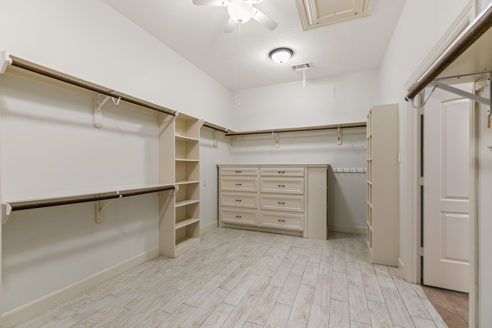 3811 Rayford Road Spring, TX 77386 - Photo 25 of 50 a view of walk in closet with empty racks