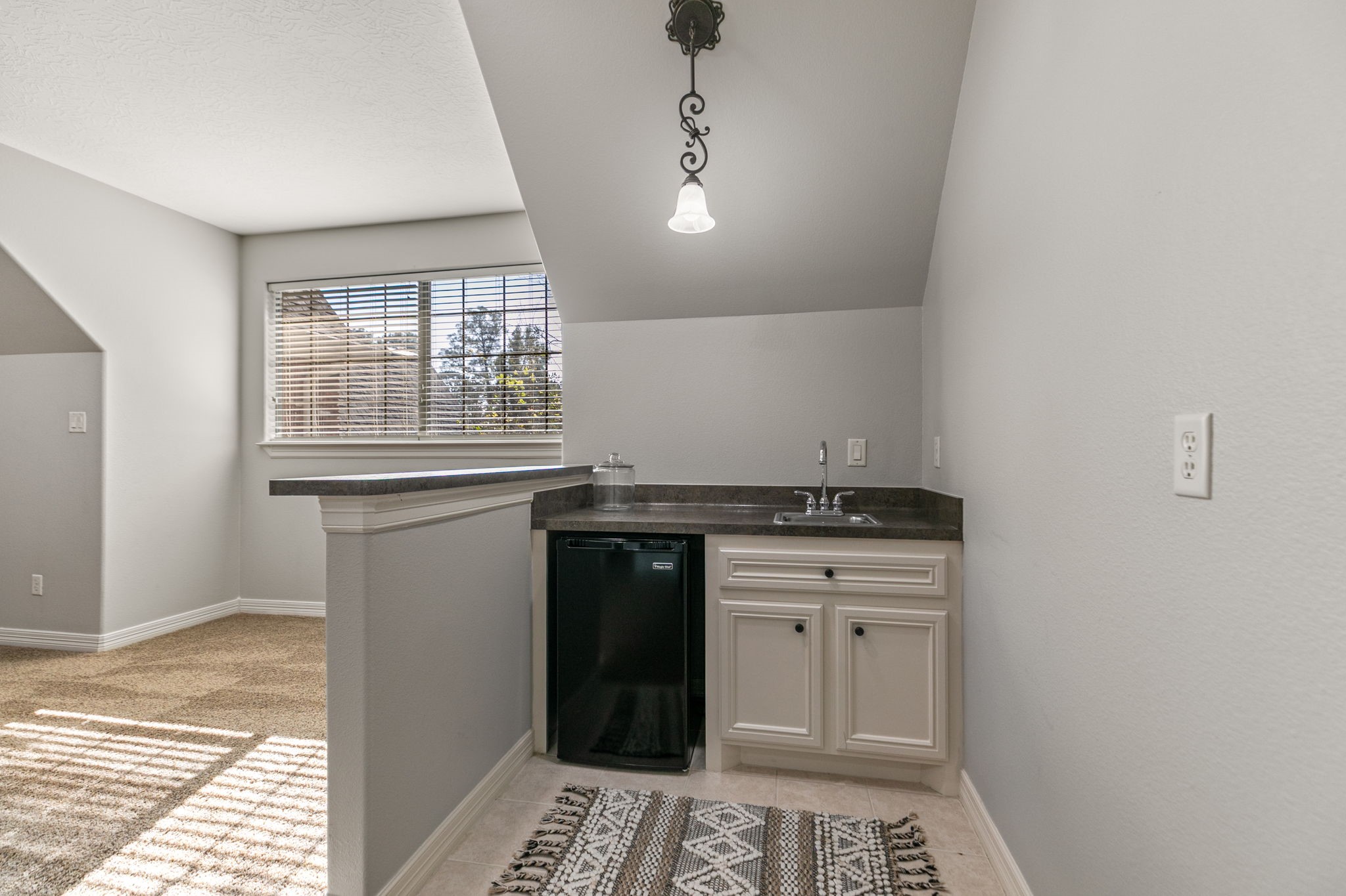 3811 Rayford Road Spring, TX 77386 - Photo 29 of 50 a kitchen with granite countertop a sink and a stove