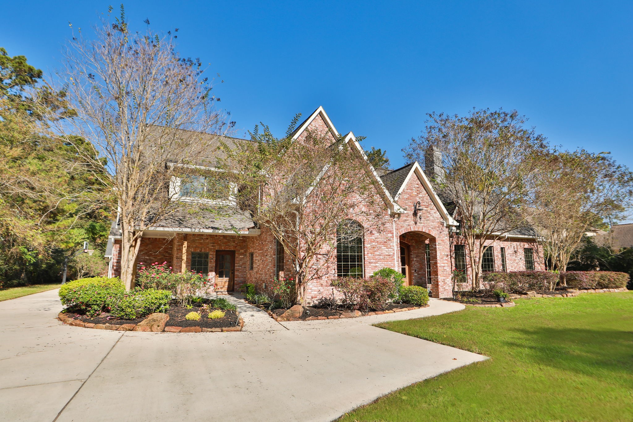 3811 Rayford Road Spring, TX 77386 - Photo 3 of 50 a front view of a house with garden