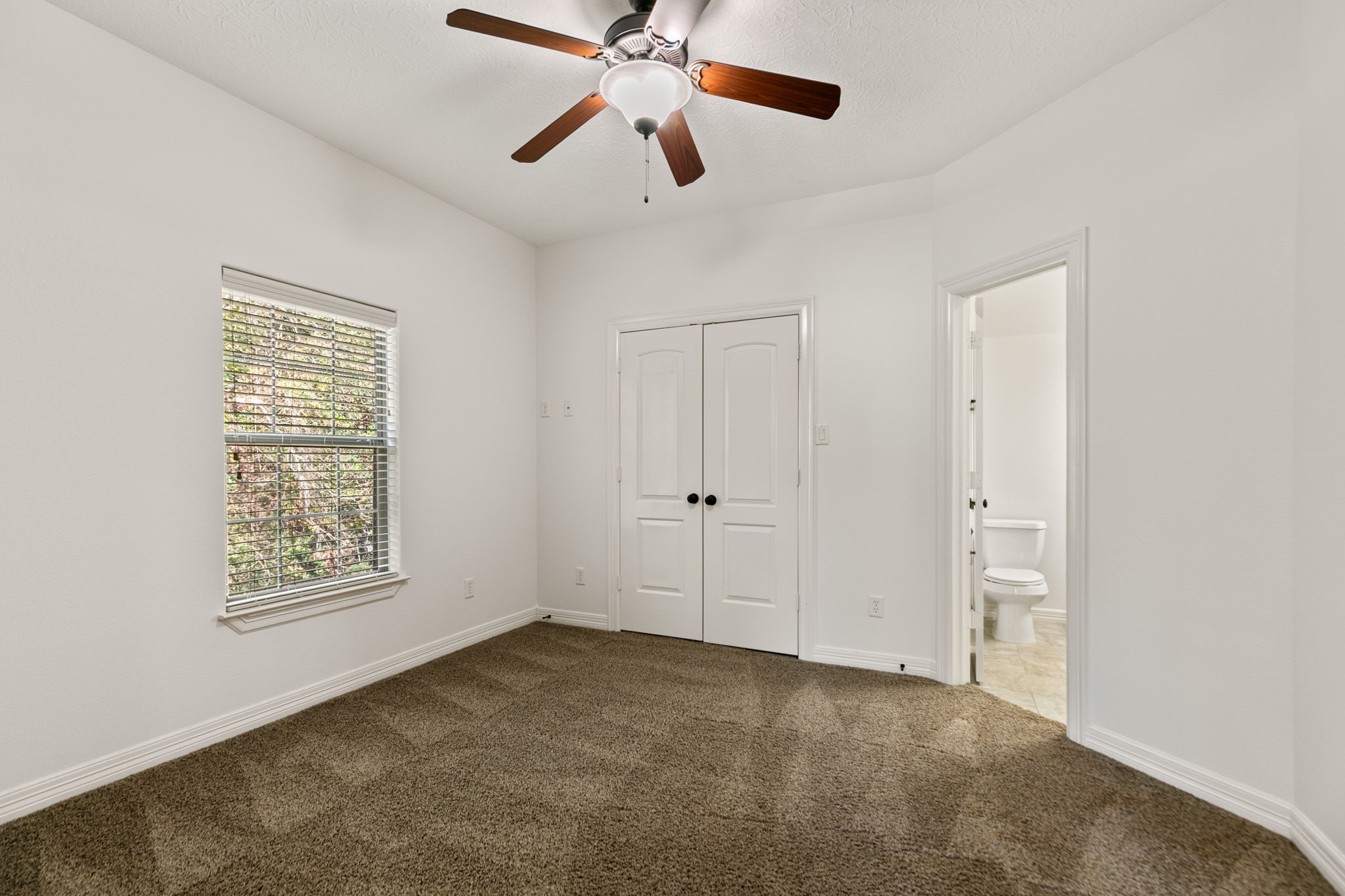 3811 Rayford Road Spring, TX 77386 - Photo 33 of 50 a view of an empty room with a window