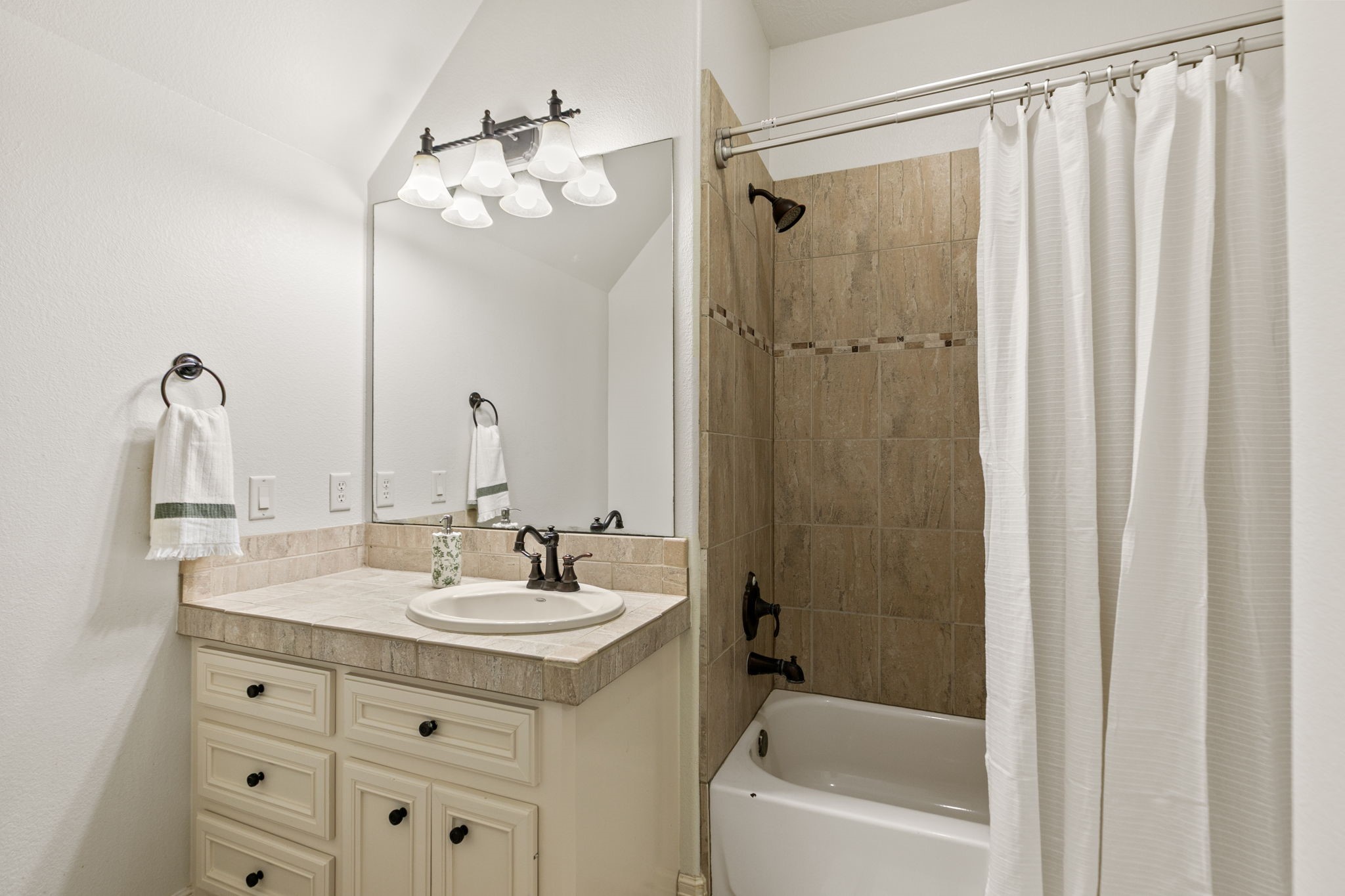 3811 Rayford Road Spring, TX 77386 - Photo 34 of 50 a bathroom with a sink a toilet and shower