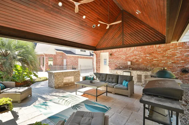 swimming view of a house with a yard patio and swimming pool