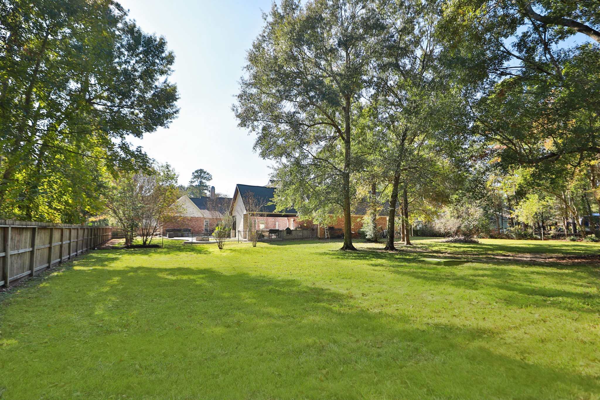3811 Rayford Road Spring, TX 77386 - Photo 46 of 50 a view of a big yard with a house and large trees