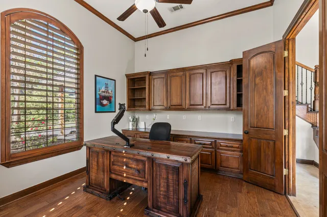 a kitchen with a refrigerator and a stove top oven