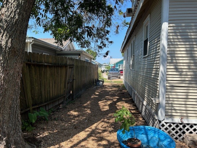 4725 Avenue R 1/2 Galveston, TX 77551 - Photo 18 of 18 a view of a wooden door with a yard