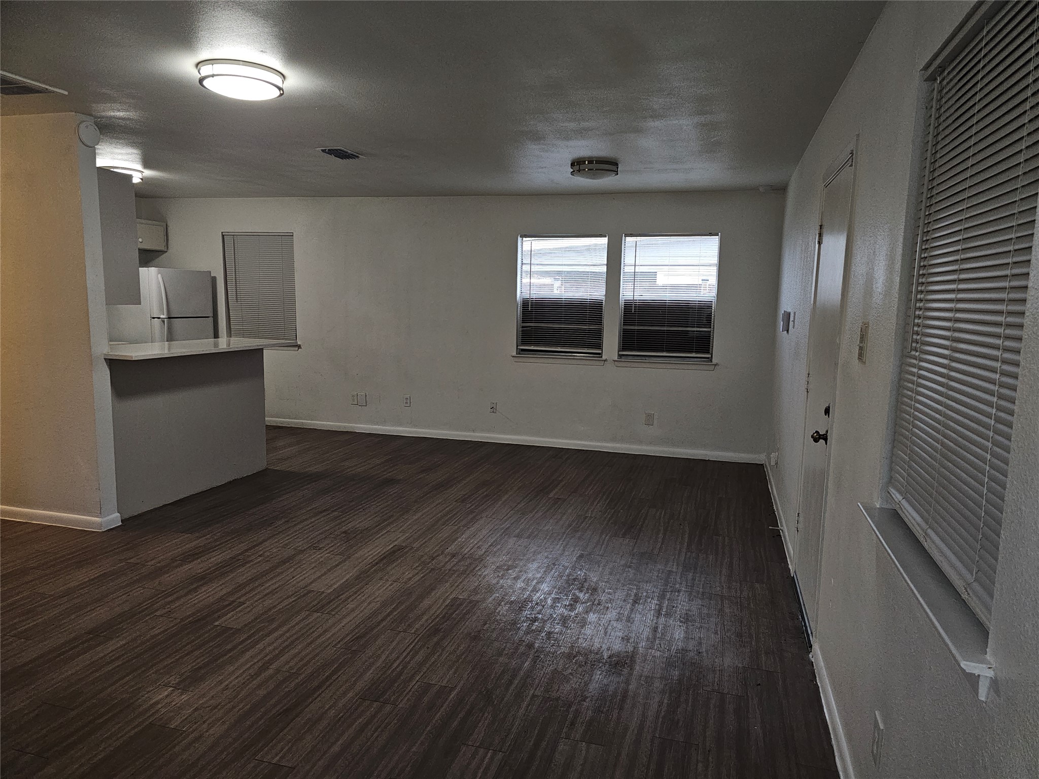 7300 Bennett Avenue, Unit B Austin, TX 78752 - Photo 3 of 11 a view of empty room with wooden floor and fan