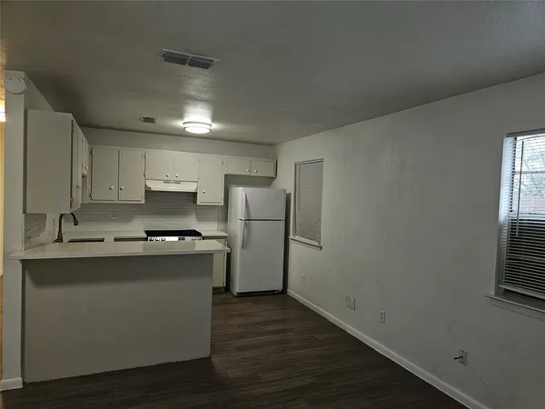 a kitchen with stainless steel appliances a sink stove and refrigerator