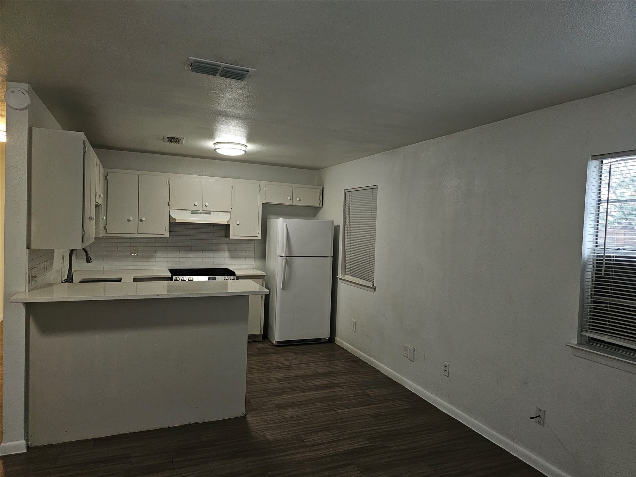 7300 Bennett Avenue, Unit B Austin, TX 78752 - Photo 4 of 11 a kitchen with stainless steel appliances a sink stove and refrigerator