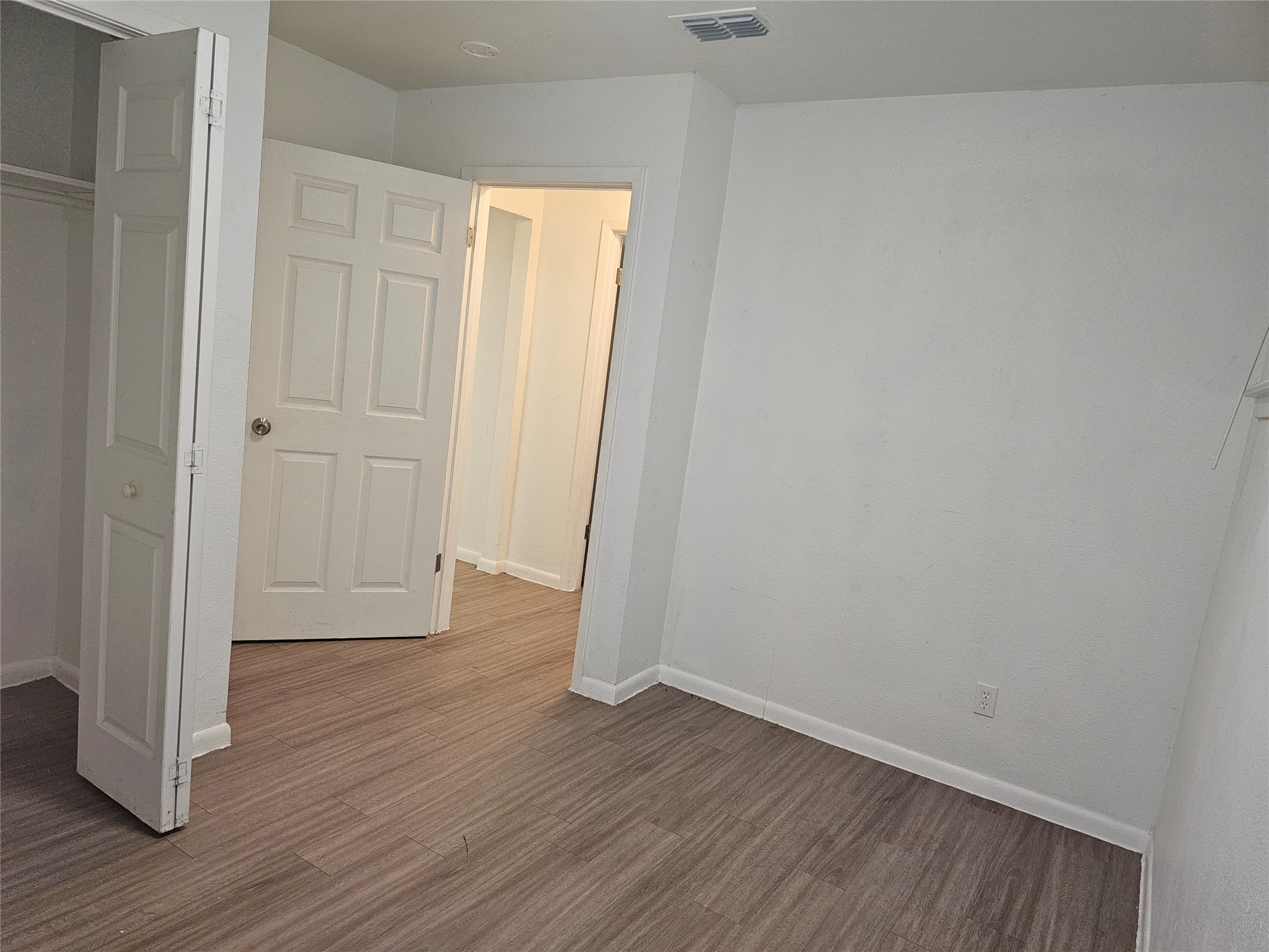 7300 Bennett Avenue, Unit B Austin, TX 78752 - Photo 7 of 11 a view of a room with wooden floor