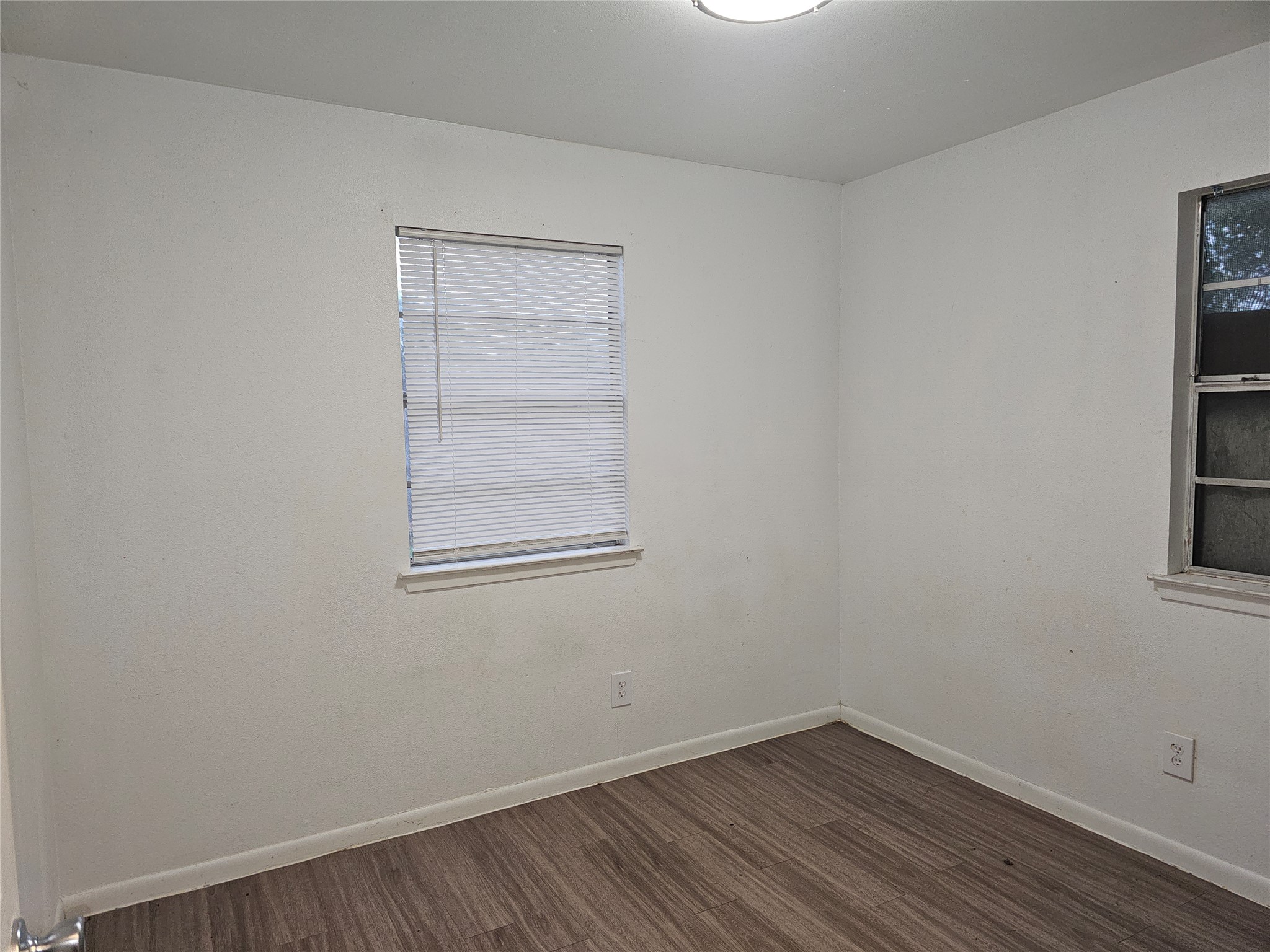 7300 Bennett Avenue, Unit B Austin, TX 78752 - Photo 9 of 11 a view of a small space with wooden floor and a window