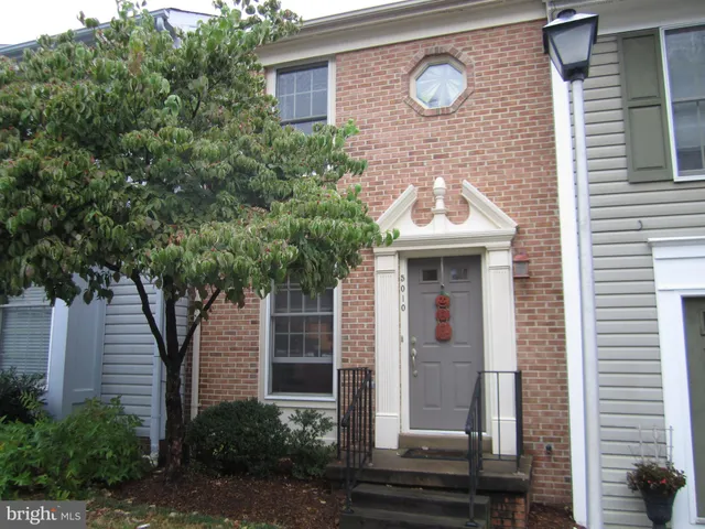 a front view of a house with yard