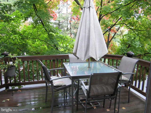 a view of a chairs and table in patio