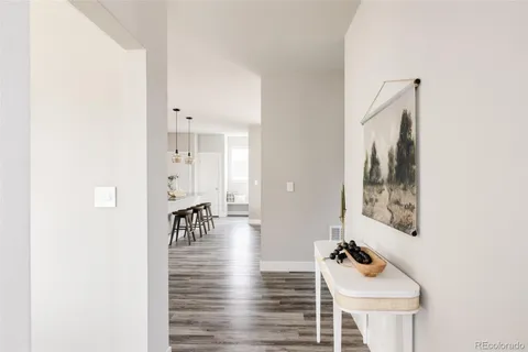 a room with furniture and wooden floor