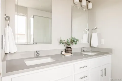 a bathroom with sink and mirror