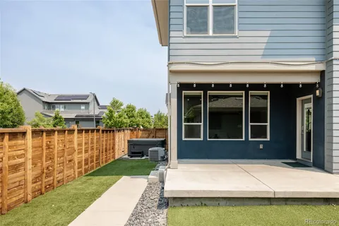 a view of a brick house with a large window