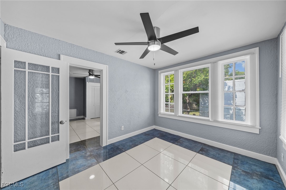 290 Granada Boulevard Fort Myers, FL 33905 - Photo 17 of 37 a view of an empty room with a window