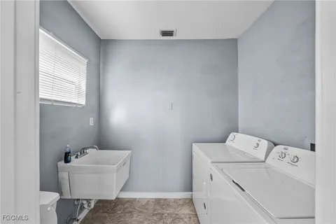 a bathroom with a bathtub and sink
