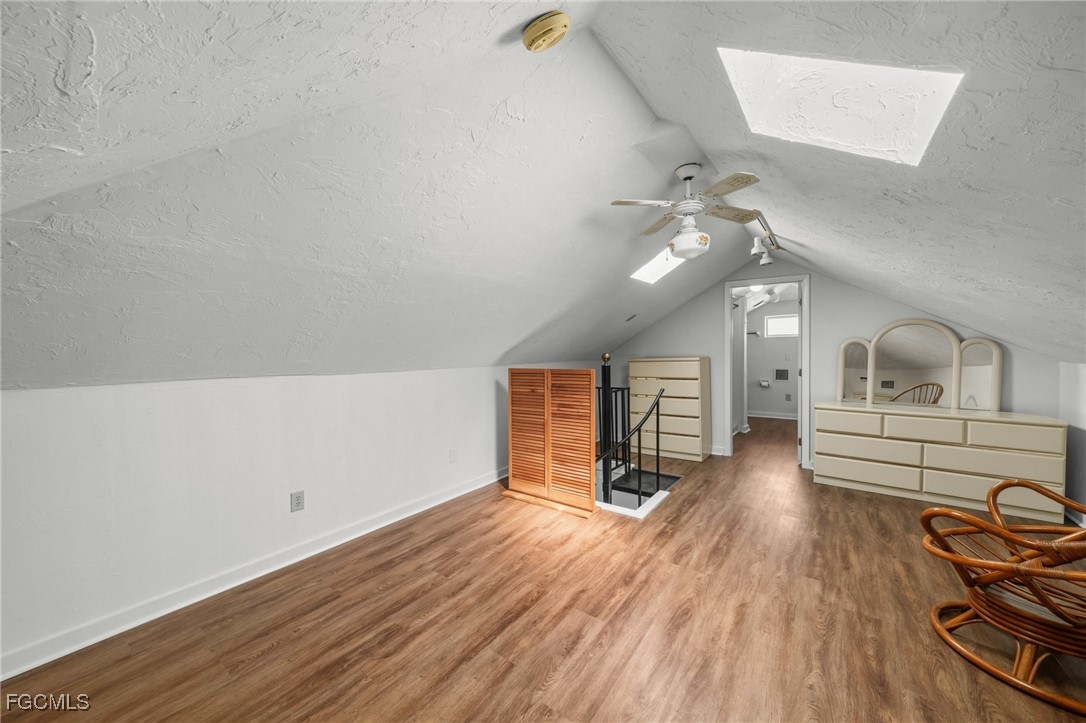 290 Granada Boulevard Fort Myers, FL 33905 - Photo 23 of 37 a view of a livingroom with furniture wooden floor and a ceiling fan