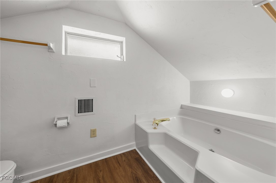 290 Granada Boulevard Fort Myers, FL 33905 - Photo 26 of 37 a bathroom with a bathtub and sink