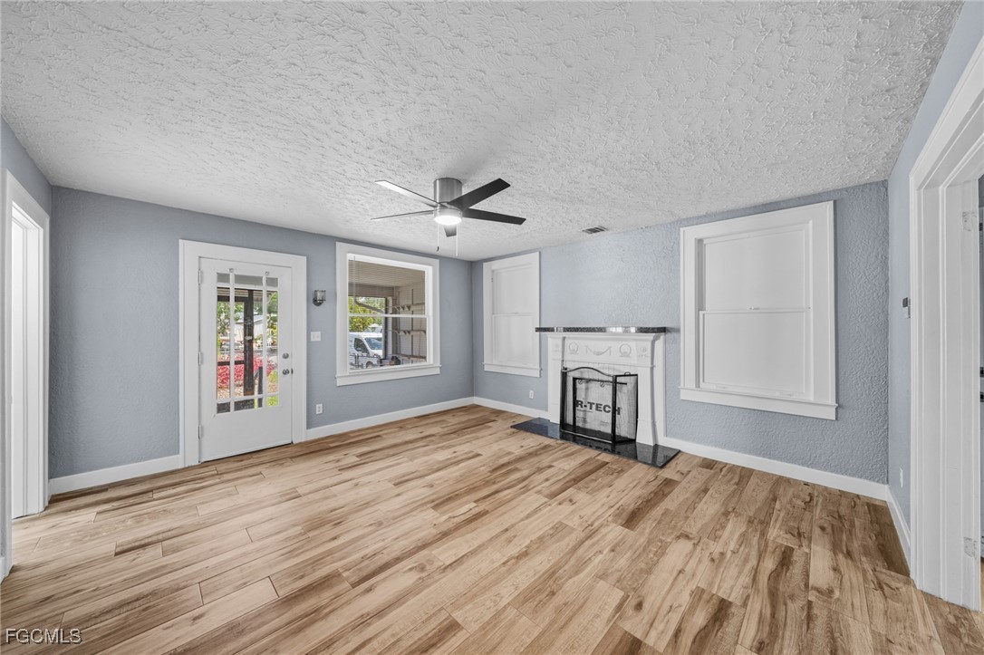 290 Granada Boulevard Fort Myers, FL 33905 - Photo 3 of 37 a view of empty room with wooden floor and window