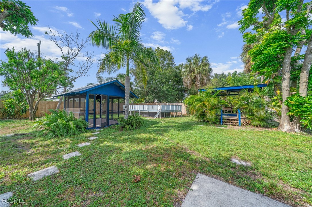 290 Granada Boulevard Fort Myers, FL 33905 - Photo 31 of 37 a view of a house with a yard
